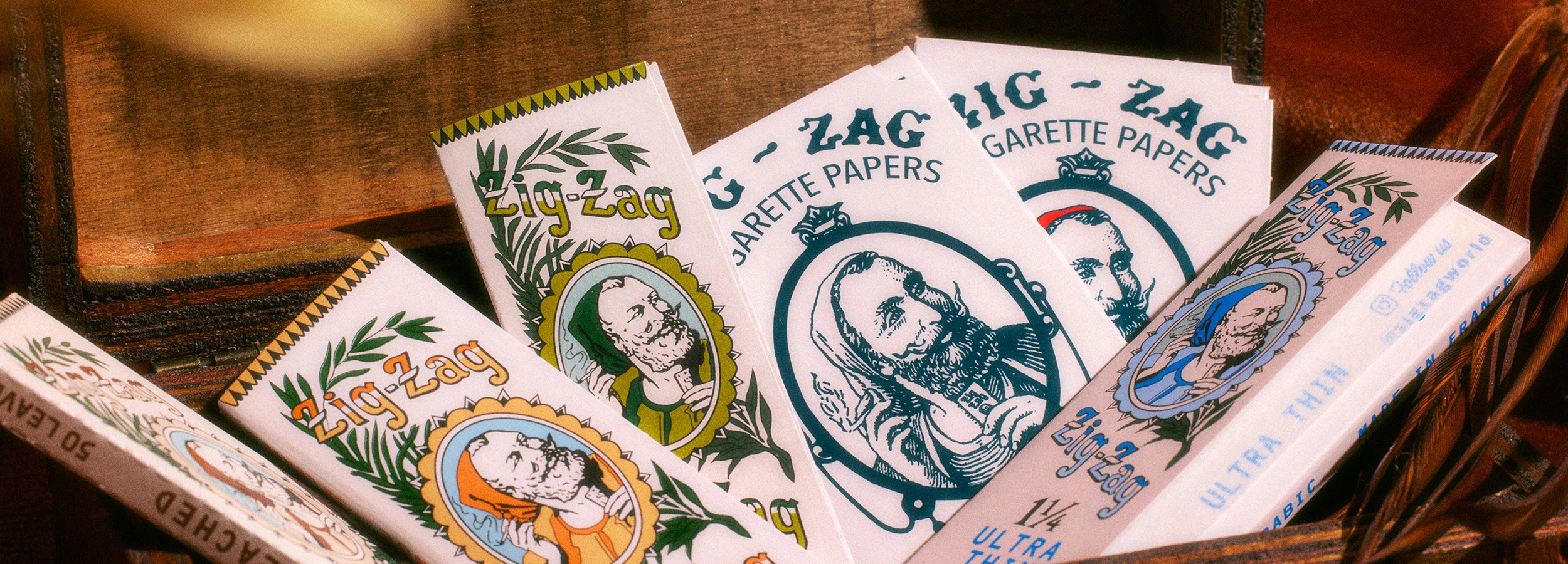 Zig-Zag vintage collection collage with classic rolling paper designs and branded merchandise