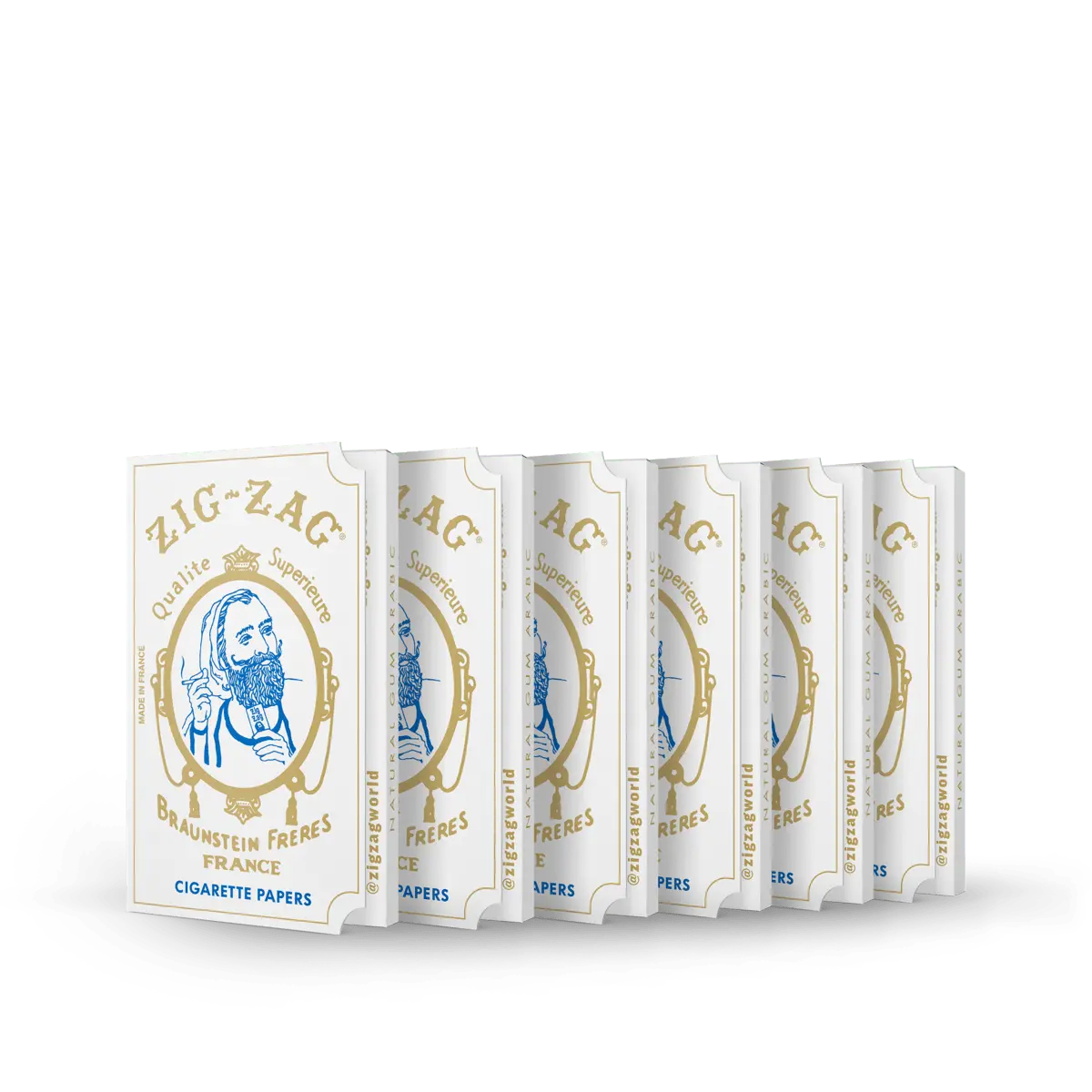 Cigarette papers in Zig-Zag Qualité Supérieure white and gold packs, displayed in a row on a dark green background.