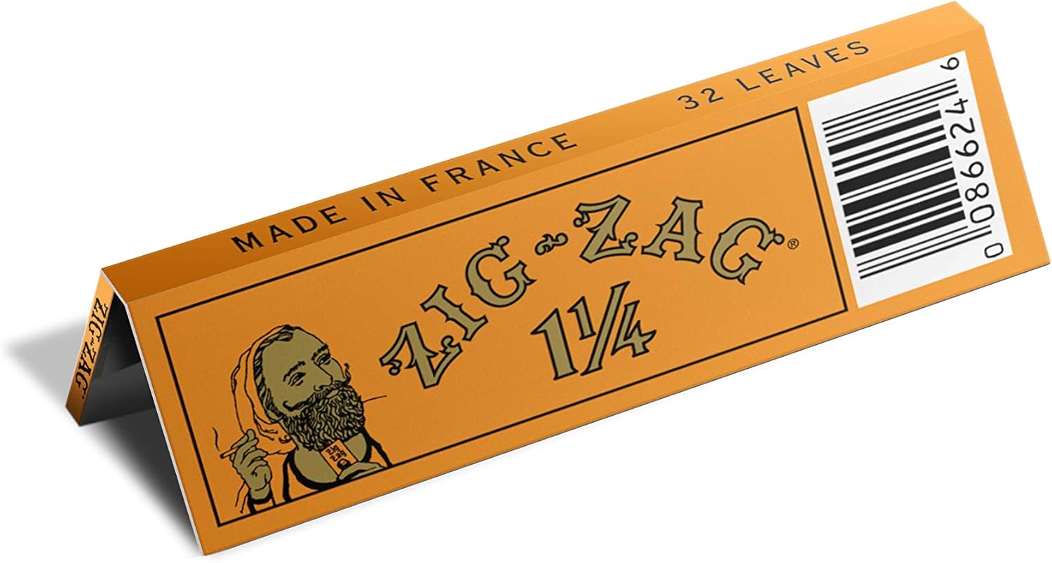1 1/4 rolling papers from Zig-Zag featuring classic orange packaging with 32 leaves and made in France.
