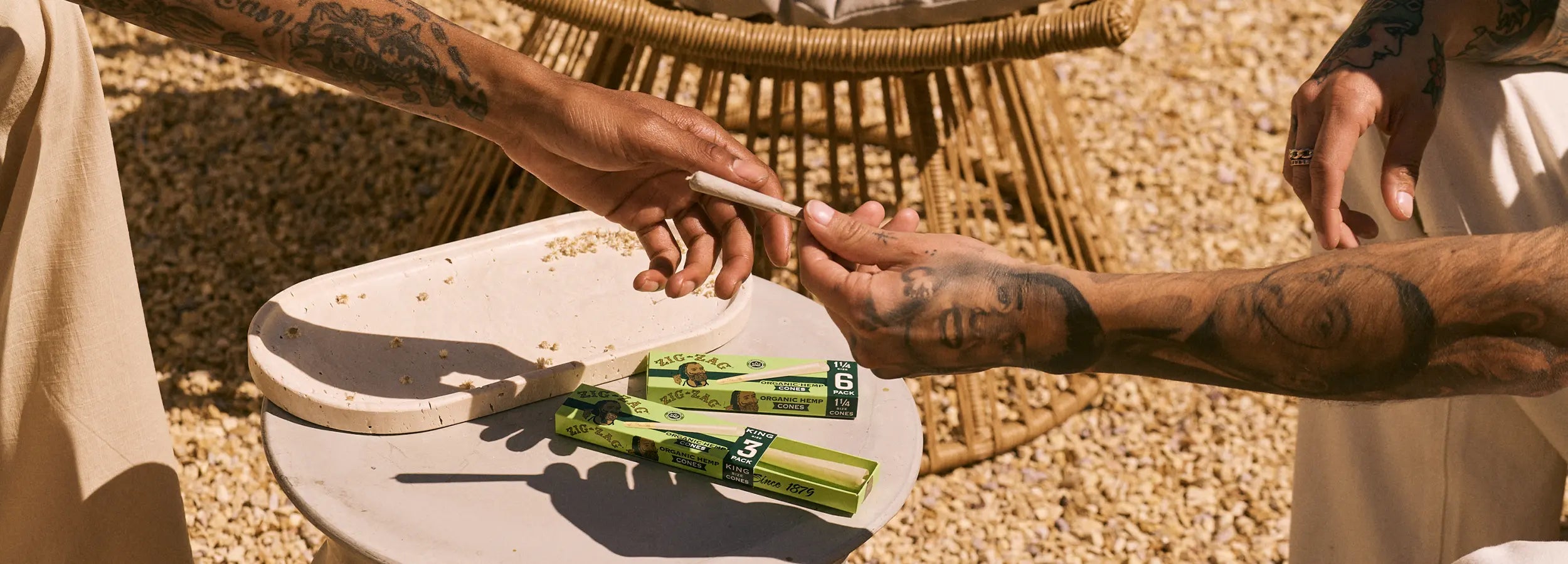 Hemp rolling papers Zig-Zag Organic Hemp Cones being shared outdoors, emphasizing natural and social smoking experience.