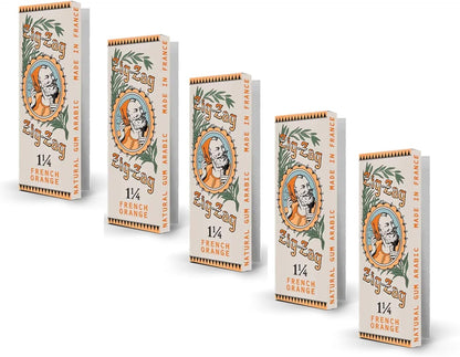 1 1/4 papers in Zig-Zag French Orange packs with natural gum Arabic, displayed in a row on white background.
