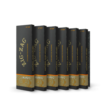 King-sized rolling papers 6 pack from Zig-Zag featuring a sleek black and gold design with natural gum arabic for a premium slow-burning experience.