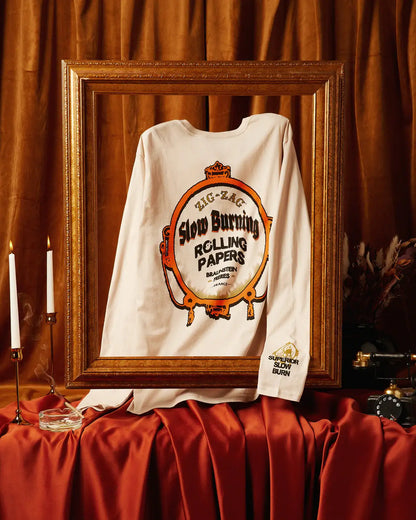 Long sleeve t-shirt featuring Zig-Zag slow burning rolling papers design displayed in an ornate frame setup.