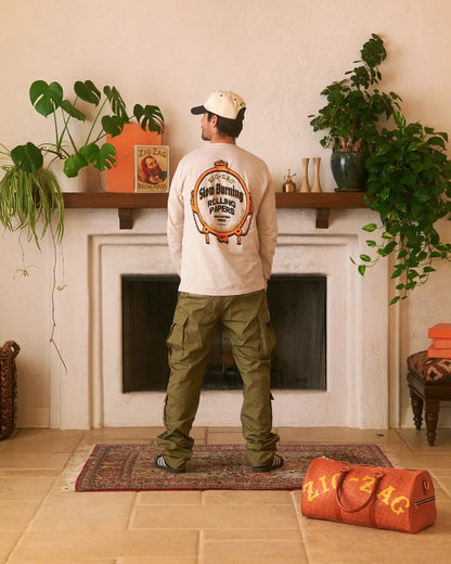Long sleeve Zig-Zag t-shirt with large vintage slow burning design on the back, worn with olive cargo pants.