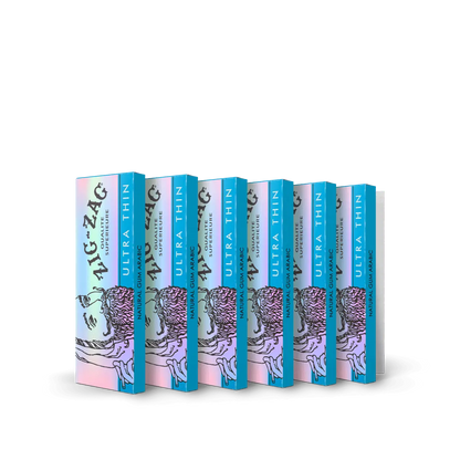 Ultra thin rolling paper 6 pack featuring holographic Zig-Zag design and natural gum arabic for a slow, even burn.